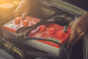 A,Car,Mechanic,Replaces,A,Battery,/,Soft,Focus,Picture