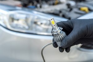 Installing,Replacement,New,Modern,Halogen,Led,Car,Headlight,Bulb.,Mechanic